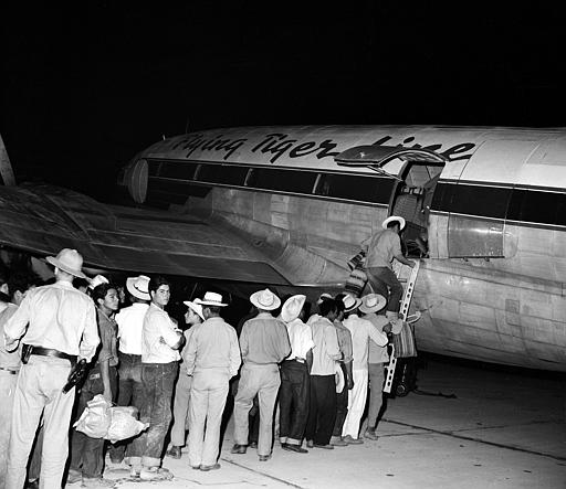 Illegal Mexican migrant workers board an airliner